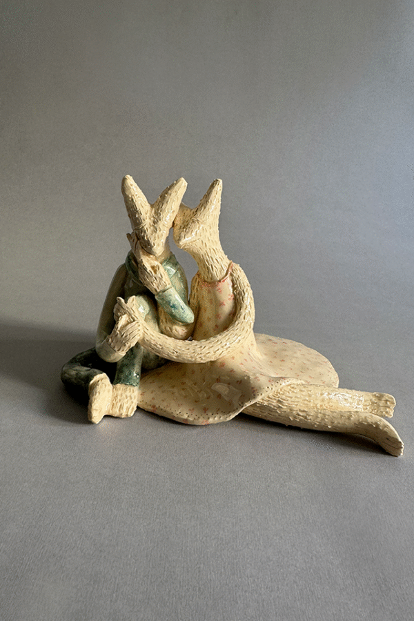 Pareja de ceramica acurrudados