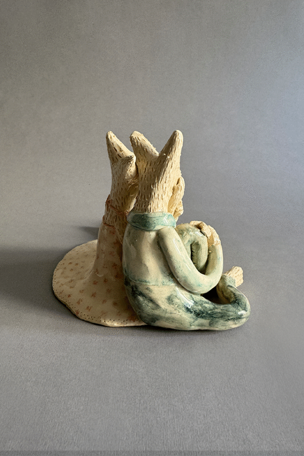 Pareja de ceramica acurrudados