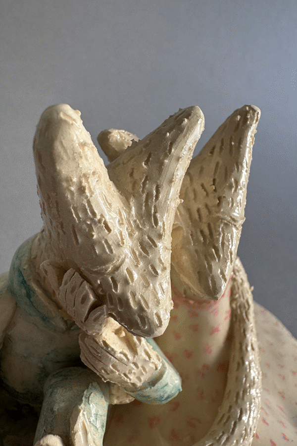 Pareja de ceramica acurrudados